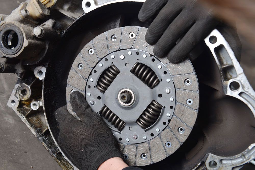 Mechanic installing a new clutch 